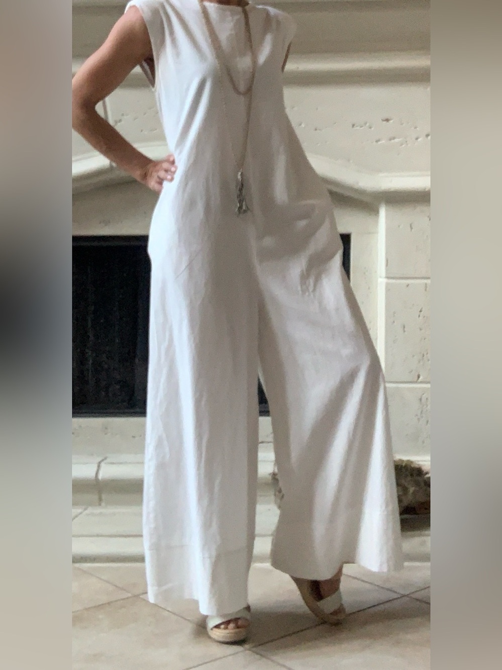 White Sleeveless Wide-Leg Jumpsuit by Uoozee